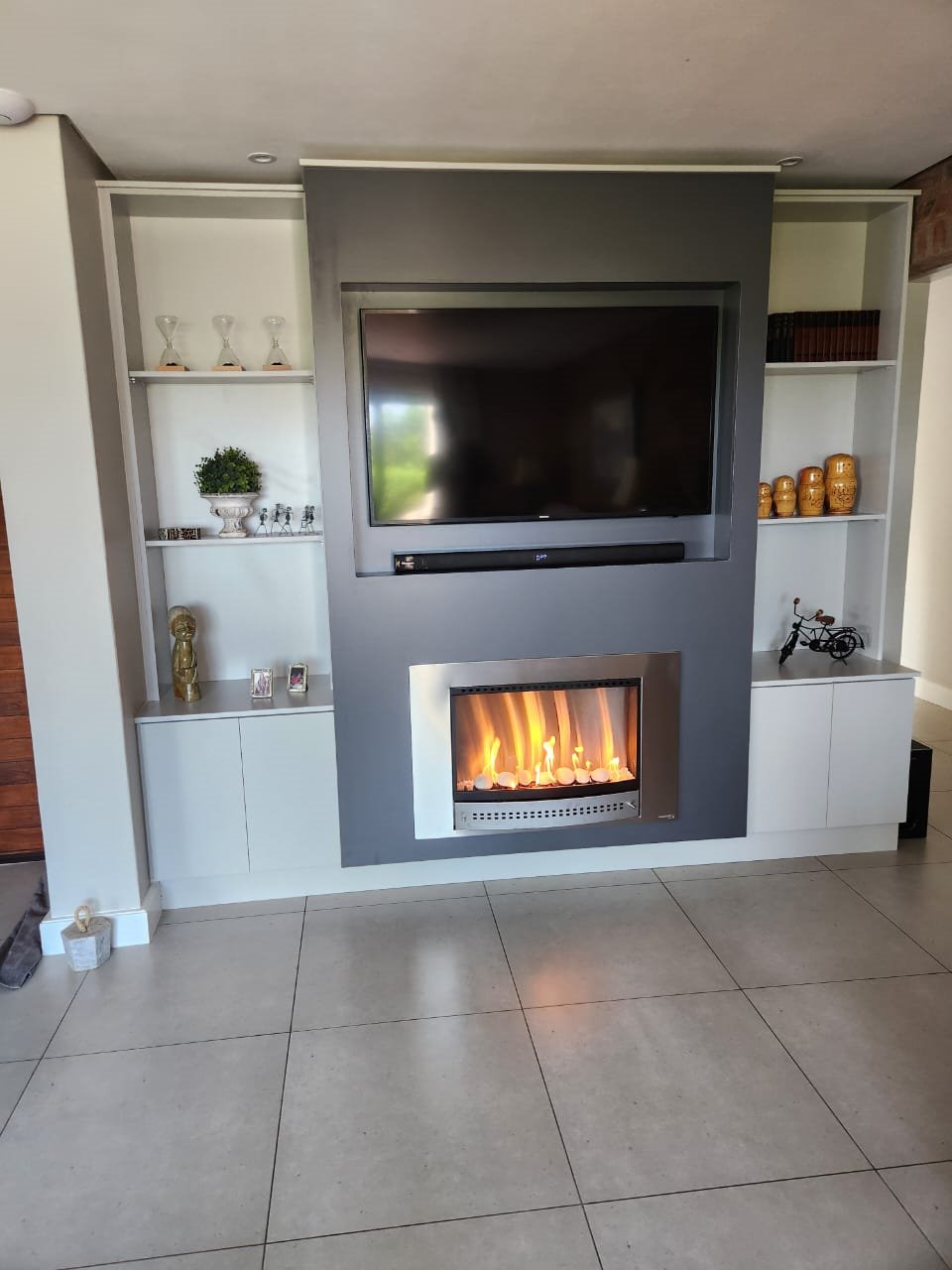 View living room projects in the gallery Finished living room TV and fireplace feature wall