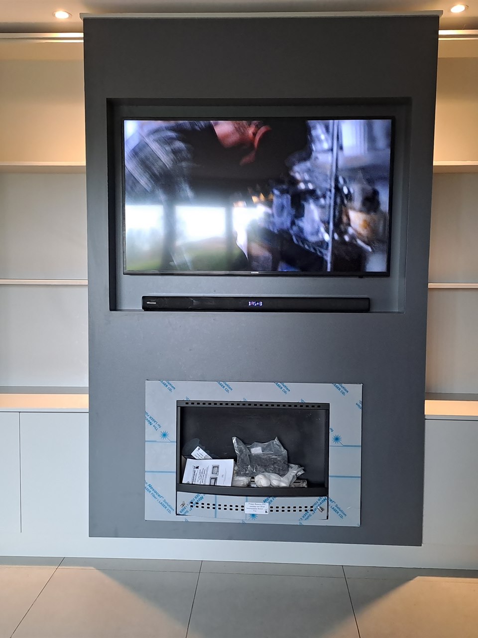 View this project in the gallery Custom living room TV feature wall and fireplace unit