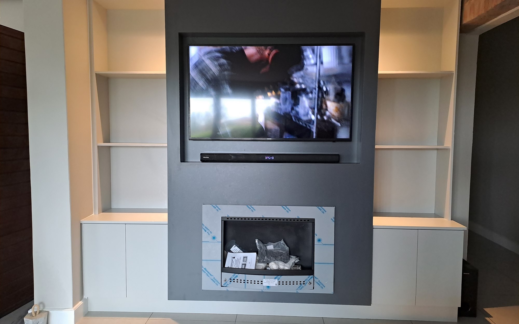View this project in the gallery Custom living room TV and fireplace unit built by 2G Custom Furniture